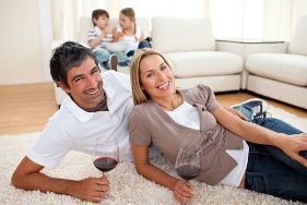 stock-photo-affectionate-lovers-drinking-wine-lying-on-the-floor-in-the-living-room-46434331
