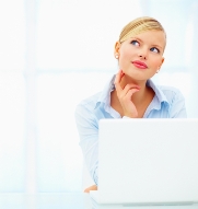 stock-photo-closeup-portrait-of-a-young-woman-using-laptop-with-her-hand-on-neck-24664831